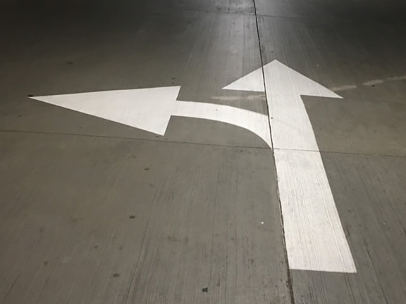 Directional Arrows Painted in Parking Lot